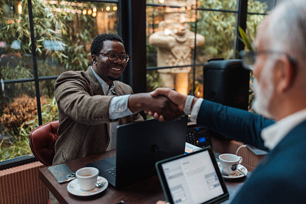 istock Casual Conversation Over Coffee in a Modern Cafe 2239928963