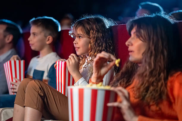 istock Caucasian Family Engaged in Cinema Viewing Experience 2239930156