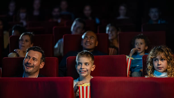 istock Diverse Audience Enthusiastically Watching Film in Cinema 2239930203