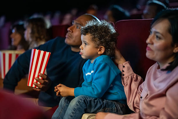 istock Hispanic Family Enjoying Time Together in Cinema Setting 2239930236