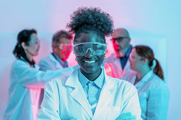 Diverse scientific team collaborating in neon-lit research laboratory