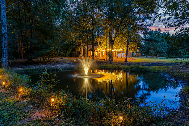 istock Pond & Cabin at Twilight with Lights 2239932618