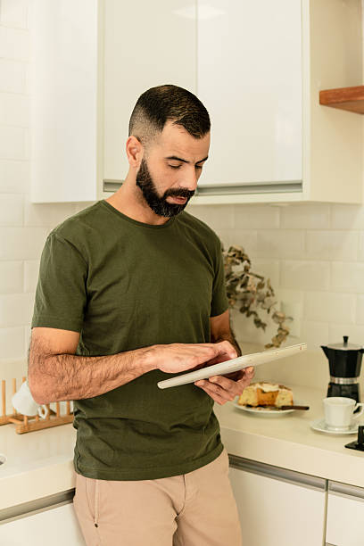 istock male amputee typing on screen of tablet 2239933601