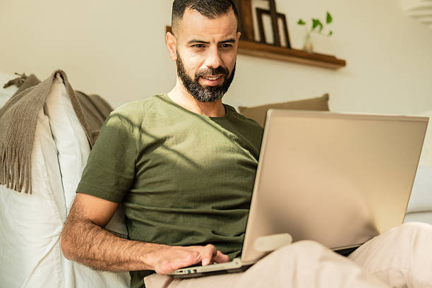 istock male fingers amputee working and typing in laptop 2239933663