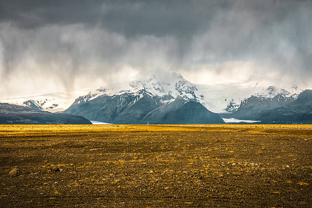 istock Desert landscape with snowy mountains and stormy sky 2239934030