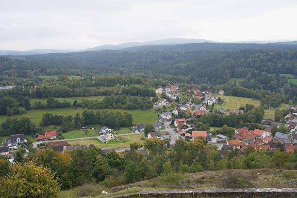 istock Ancient castle ruins overlooking picturesque village in bavarian forest 2239934330