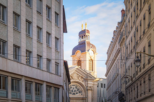 The Church of Saint-Nizier is a church in the Presqu'île district of Lyon. Begun in the 14th century and only completed in the 19th century, the church contains a variety of architectural styles, ranging from the neo-Gothic spire to the classical Renaissance facade. Captured during spring season with the two towers.