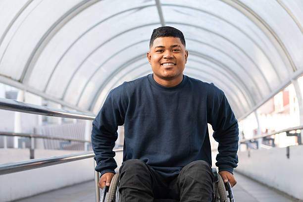 disabled person climbing tunnel ramp looking forward