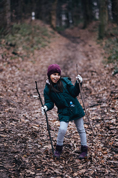 istock Child smiling, enjoying autumn nature walk in forest 2239938171