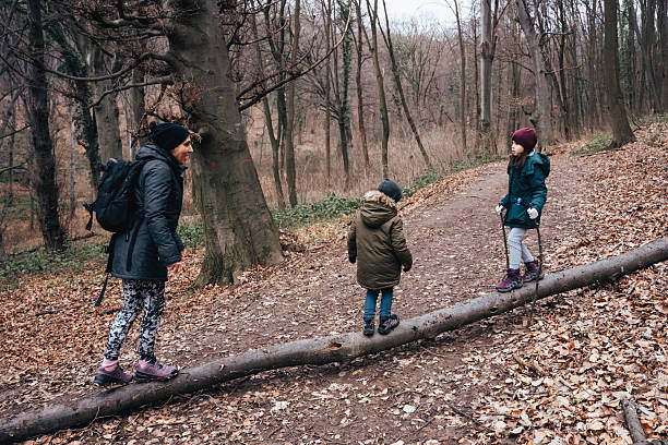 Photo of a family picking up the river garbage, cleaning up the environment, and protecting the health of the river ecosystem.