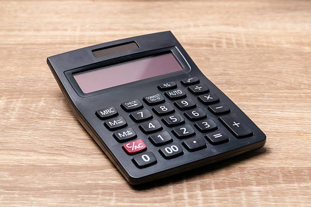 istock A black digital calculator on a wooden table 2239940741