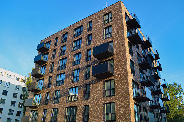 istock Modern brick apartment building with balconies 2239941571