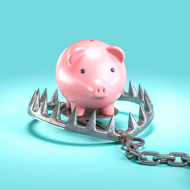 istock Piggy bank standing on bear trap risking savings 2239941573