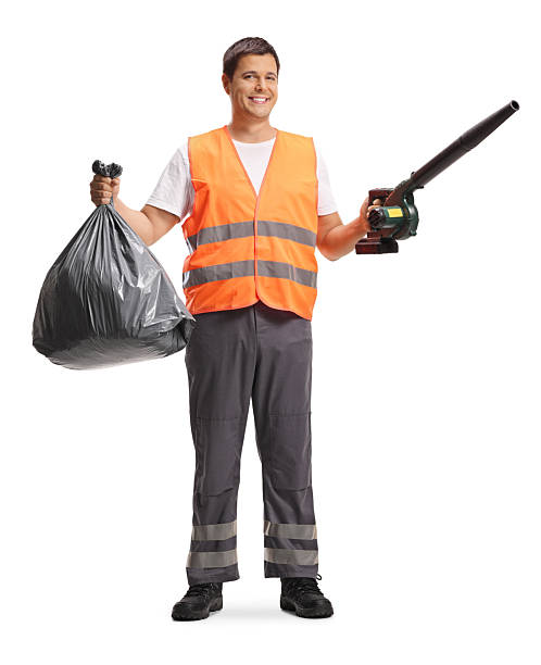 istock Municipal worker hoilding a leaf blower and a plastic bin bag 2239944684