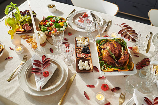 istock Thanksgiving Table Setting Featuring Roast Turkey and Assorted Autumn Dishes 2239946152