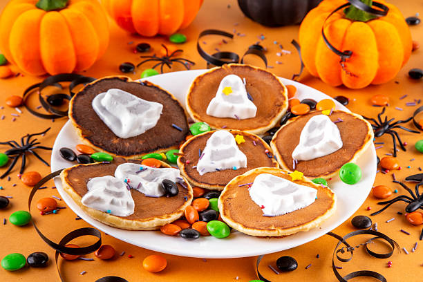 istock Tasty Halloween pancakes topped with marshmallow ghosts 2239946312