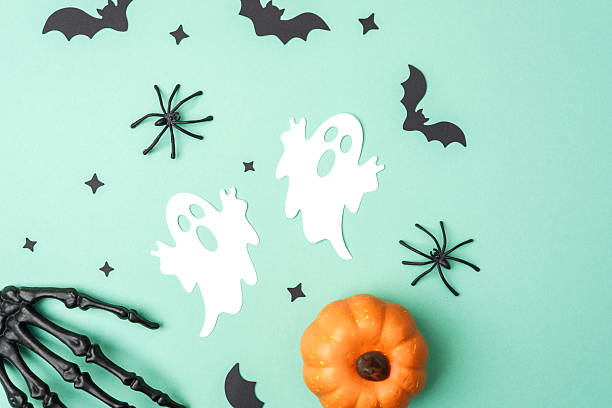 istock Halloween decoration: ghost, spider, bat, pumpkin, skeleton hand, stars on aqua background 2239948380