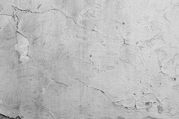 istock Black and white cracked wall with peeling paint for vintage building and distressed surface concept 2239948409