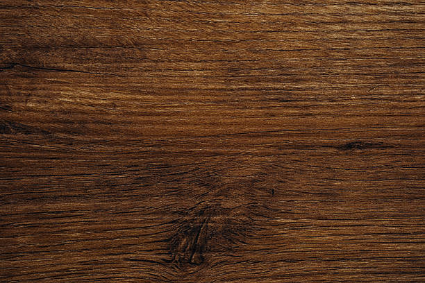 istock Dark brown hardwood texture with flowing grain and deep natural lines 2239948480