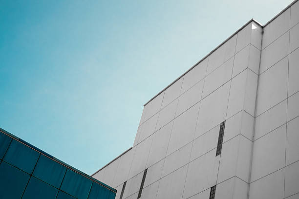 istock White modern office building with beautiful blue sky at the morning 2239948944