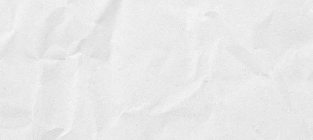 istock Abstract white crumpled and creased recycle paper texture background 2239950972