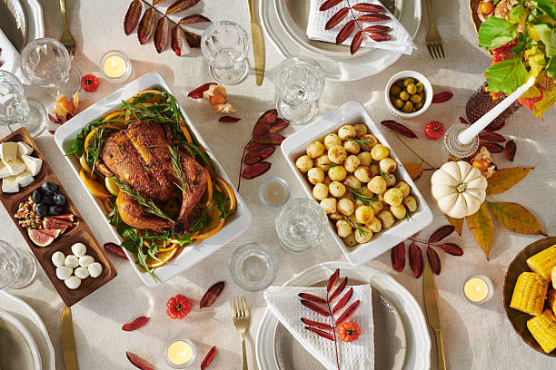 istock Thanksgiving Table Setting Featuring Roasted Chicken and Assorted Autumn Foods 2239951069