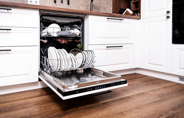 istock built-in dishwasher open with clean plates and utensils in stylish kitchen 2239951206