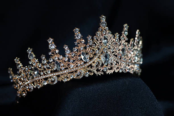 istock Golden Crown with gems and diamonds on black background 2239951224