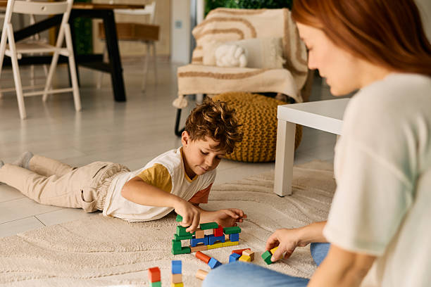 istock Mother and son playing with colorful building blocks 2239952496