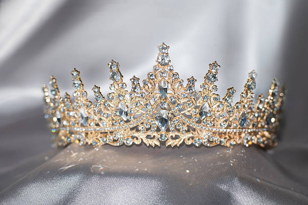 istock Golden Crown with gems and diamonds on grey background 2239952741