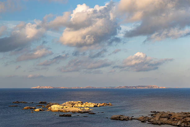 Close to Santa Teresa Gallura, Punta Marmorata is bordered by little islands made of huge boulders. These rock formations counter the often rough waters of the Strait of Bonifacio. Here's the amazing seascape at dusk.