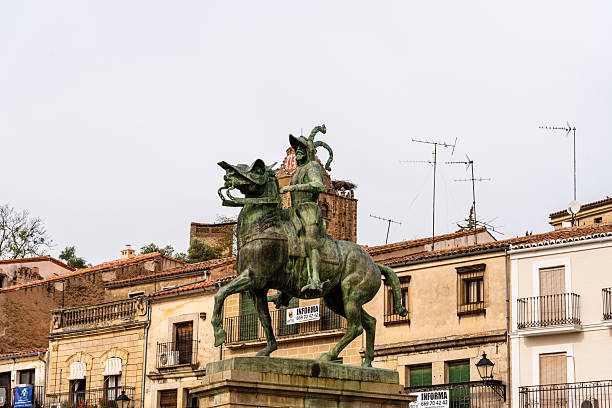 Trujillo, Spain - October 18, 2022: The statue of Hernan Cortes in Trujillo, Extremadura, Spain, surrounded by historic architecture and town square.