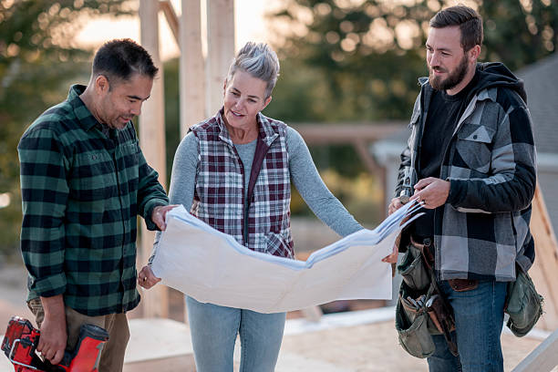 istock Diverse Team Plans A Home Build At A Construction Site, Collaborating Over Blueprint 2239956683