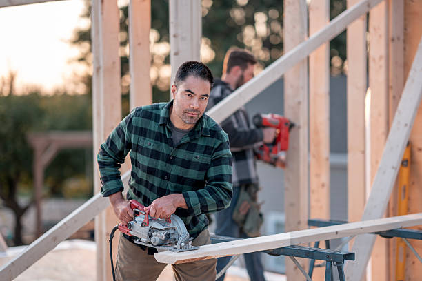 istock Hispanic Construction Worker With Power Saw Building Framing On Outdoor Construction Site 2239956692