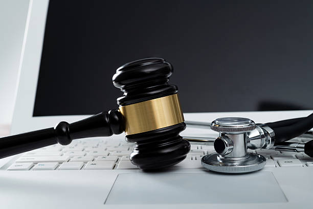 istock Gavel and stethoscope on laptop keyboard 2239963264