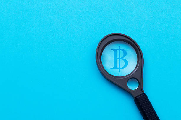 istock Magnifying glass in front of Bitcoin symbol 2239963367