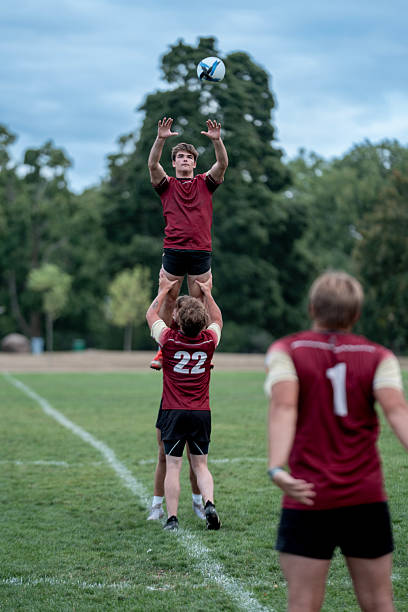 istock Rugby Lineout Moment Between Team Mates On Grass Field During a Competitive Match 2239964281