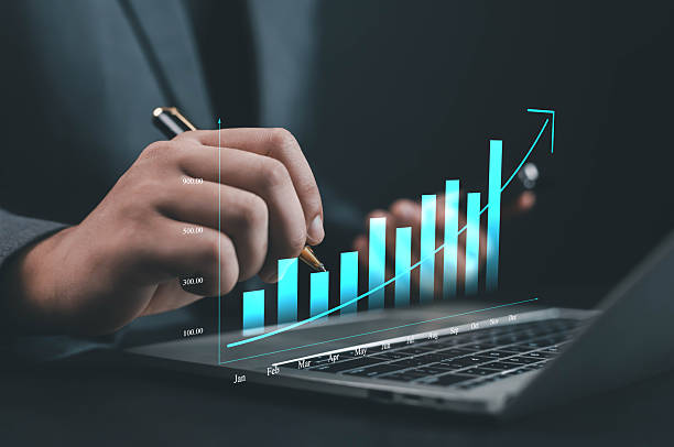 istock Business growth concept showing a person analyzing rising bar chart on laptop, symbolizing financial success, data analytics, and investment strategy for corporate performance and development. 2239964328
