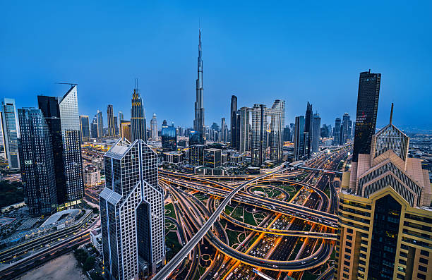 istock Dubai Skyline With Burj Khalifa And Complex Highway Interchange At Blue Hour 2239968055
