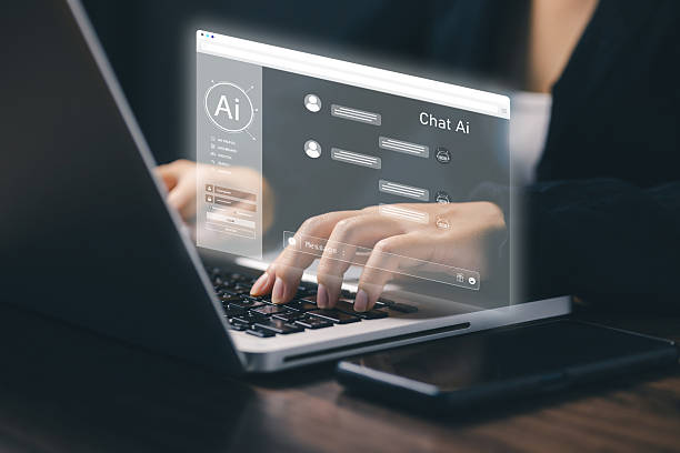 istock A woman typing on a laptop with a transparent AI chatbot interface, representing artificial intelligence, virtual assistant, machine learning, and digital customer communication platform. 2239969343