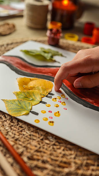 istock Autumn art project with leaves and paint 2239971556