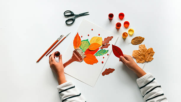 istock Autumn art project with leaves and paint 2239971564