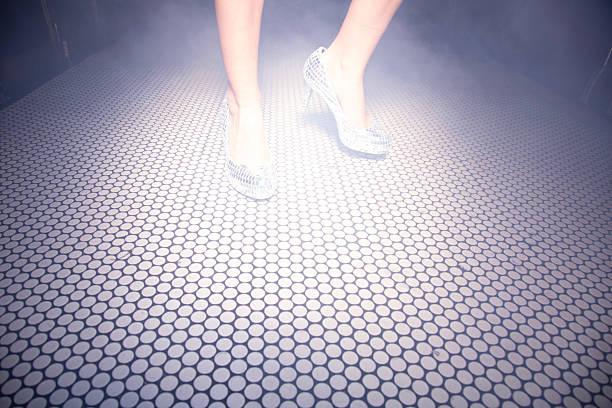A Person with crystal heels dances