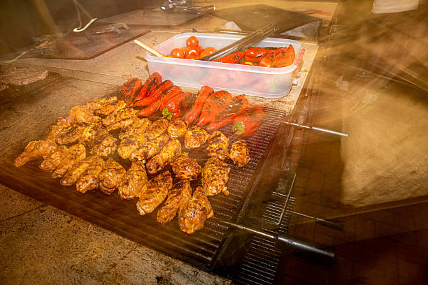 Barbecued chicken wings and red peppers