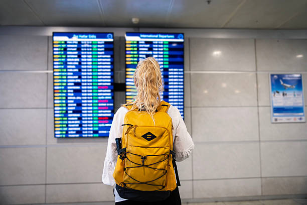 istock Woman searches for plane schedule 2239975369