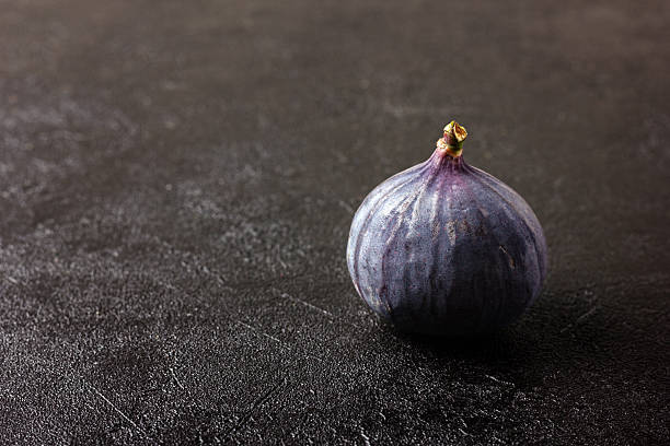 Fresh fig on a dark background.
