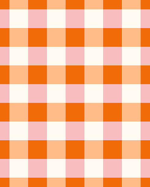 Seamless background checked gingham plaid pattern in pink and bold orange pumpkin spice mix. Vector illustrated. Editable fills.