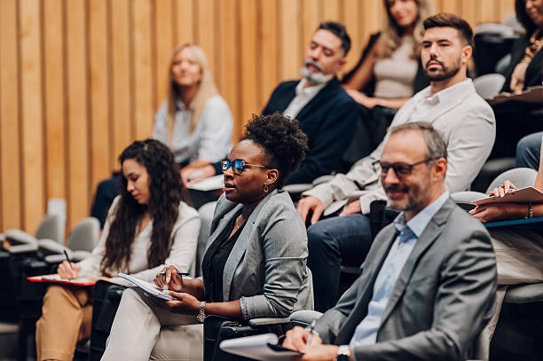 istock Professionals attending business conference, learning new skills 2239979985
