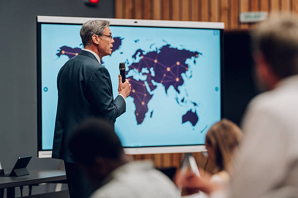Man presenting global business strategy with world map
