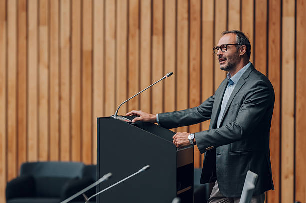 istock Man giving presentation at business conference 2239980238